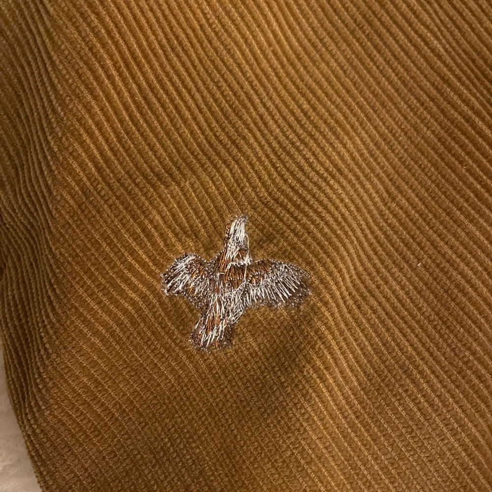 Mens corduroy slacks with quail embroidery.
